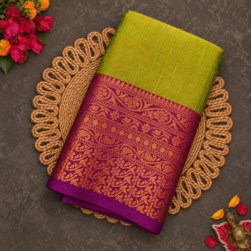 Mehendi green Vaira Oosi saree with magenta zari border