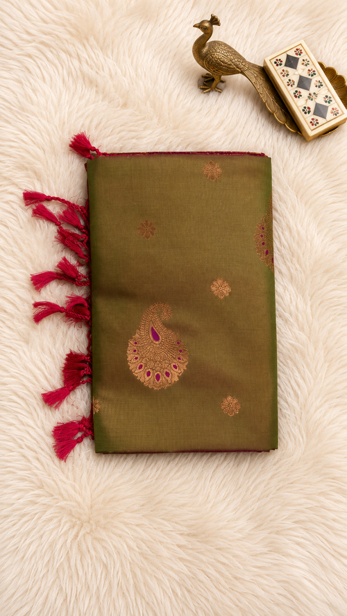 Olive green soft silk saree with gold zari paisley butta and magenta tassels