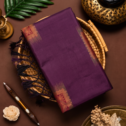 Wine purple soft silk saree with maroon Meena work border and tassels