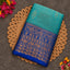 Turquoise Vaira Oosi saree with royal blue zari border