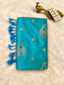 Sky blue soft silk saree with silver zari paisley butta and blue tassels